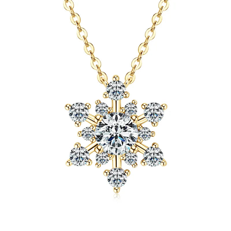 Gold necklace with a snowflake-shaped diamond pendant on a white background