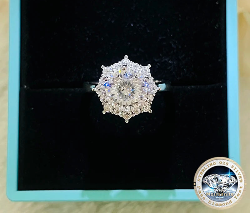 Diamond ring on a black cushion with 'Joyce Jelly' branding