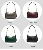 Four handbags in different colors (grey, wine red, green, black) on a light gray background.