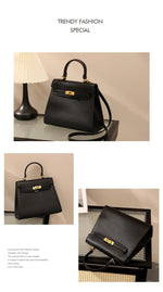 Black handbag with gold accents on a beige background