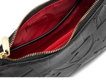 Black textured clutch bag with gold zipper and red interior