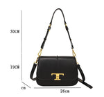 Black handbag with gold accents and measurements on a white background