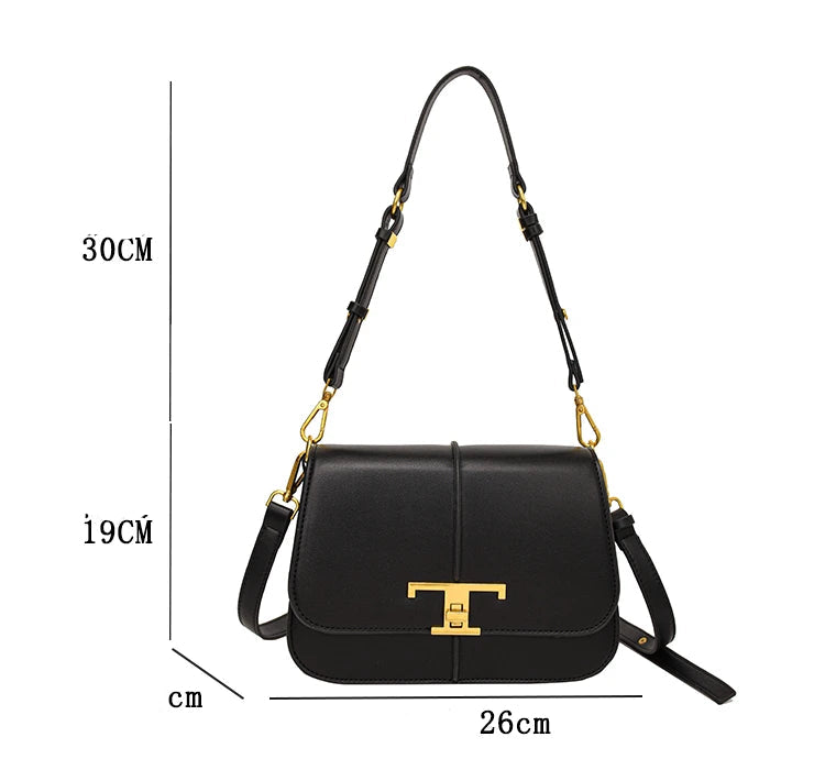 Black handbag with gold accents and measurements on a white background