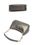 Silver handbag with gold chain strap on a white background