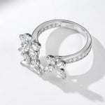 Silver ring with butterfly design on a white background