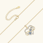 Gold necklace with a heart-shaped pendant on a white background