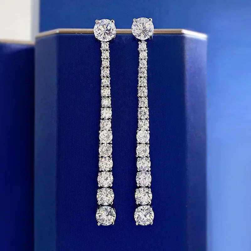 Pair of diamond earrings on a blue background