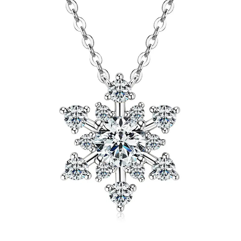 Snowflake-shaped silver necklace with clear gemstones on a white background