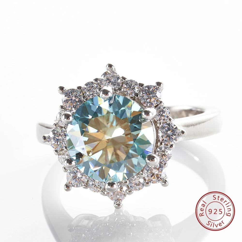 Silver ring with a large gemstone and smaller stones on a white background