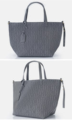 Gray handbag with monogram pattern on a white background