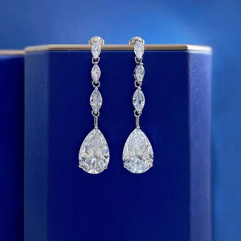 Pair of diamond earrings on a blue background
