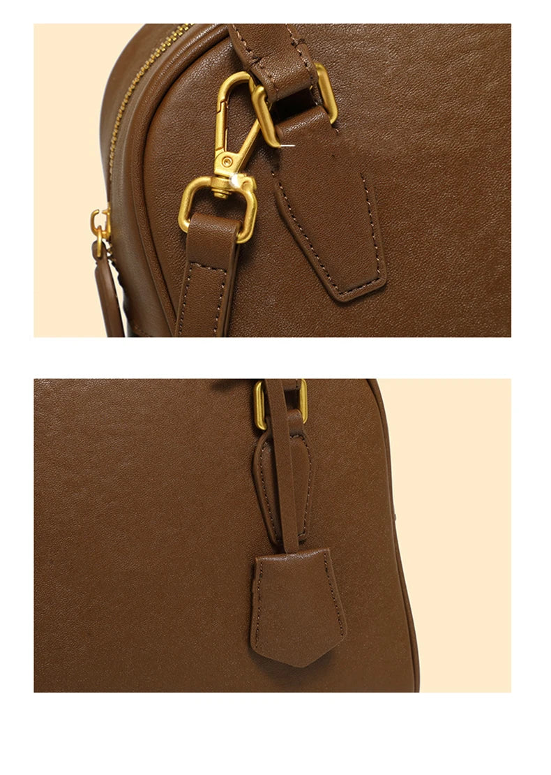 Close-up of a brown leather bag with gold hardware on a beige background