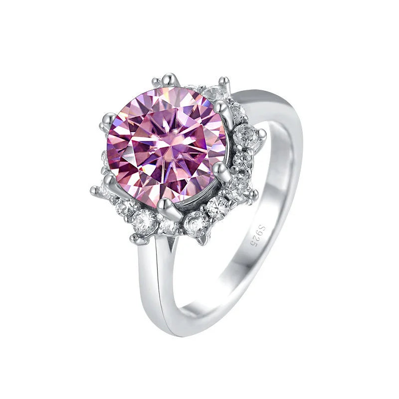 Silver ring with a pink gemstone on a white background