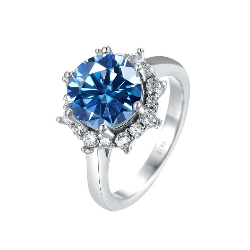 Silver ring with a blue gemstone on a white background