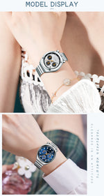 Silver watch on a wrist with a white lace garment in the background