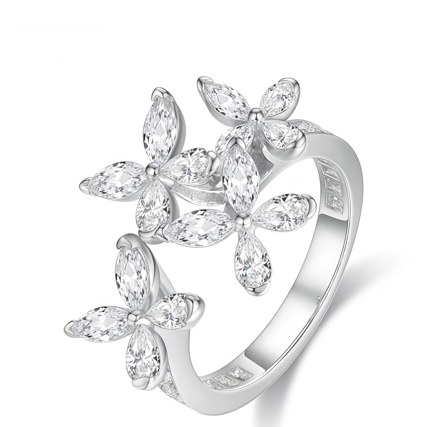 Silver ring with floral design and clear stones on a white background, branded 'WEN XIN'.
