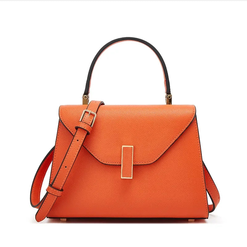 Orange handbag with a strap on a white background