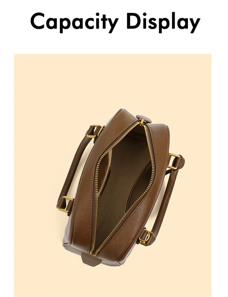 Brown handbag with gold accents on a beige background