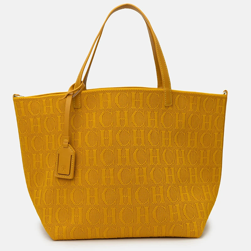 Yellow handbag with a pattern on a white background