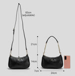 Black handbag with measurements on a light gray background