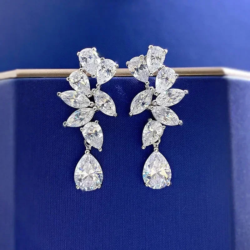 Pair of diamond earrings on a blue background