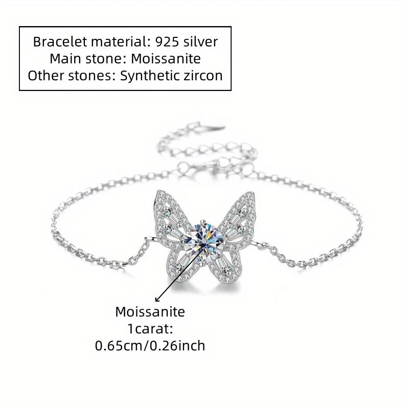 Silver bracelet with butterfly design and gemstones on a white background