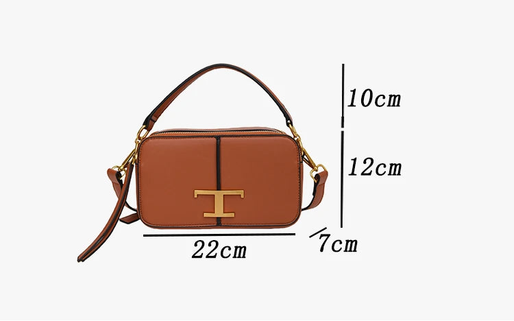 Brown handbag with gold accents and dimensions on a white background