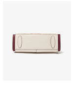 White and burgundy handbag on a white background
