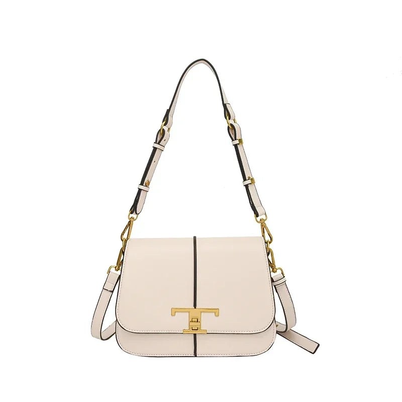 White handbag with gold accents on a white background