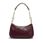 Brown handbag with gold chain strap on a white background