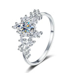 Silver ring with multiple diamonds on a white background