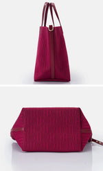 Red handbag with brown accents on a white background