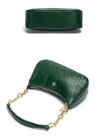 Green handbag with gold chain strap on a white background