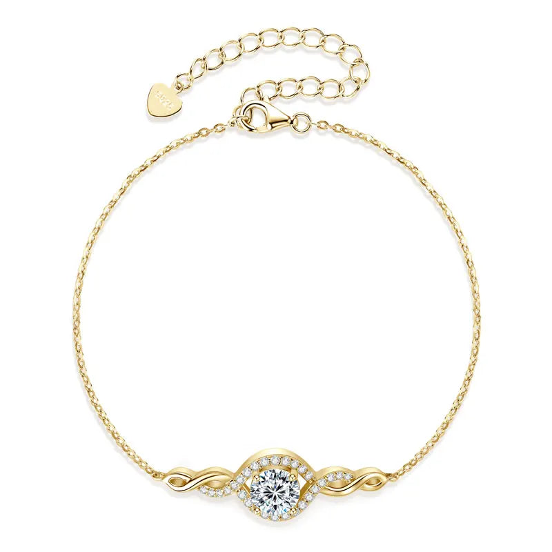 Gold bracelet with a diamond clasp on a white background