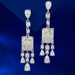 Diamond earrings on a blue background