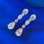 Diamond earrings on a blue background