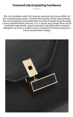 Black bag with gold hardware on a white background