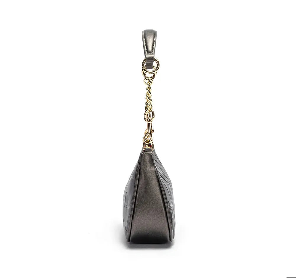 Black handbag with gold chain strap on a white background
