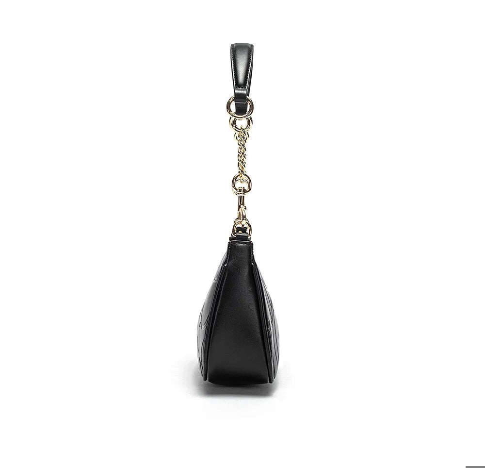 Black handbag with a gold chain on a white background