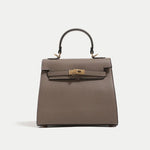 Gray handbag with a gold clasp on a white background