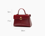 Red handbag with measurement details on a white background