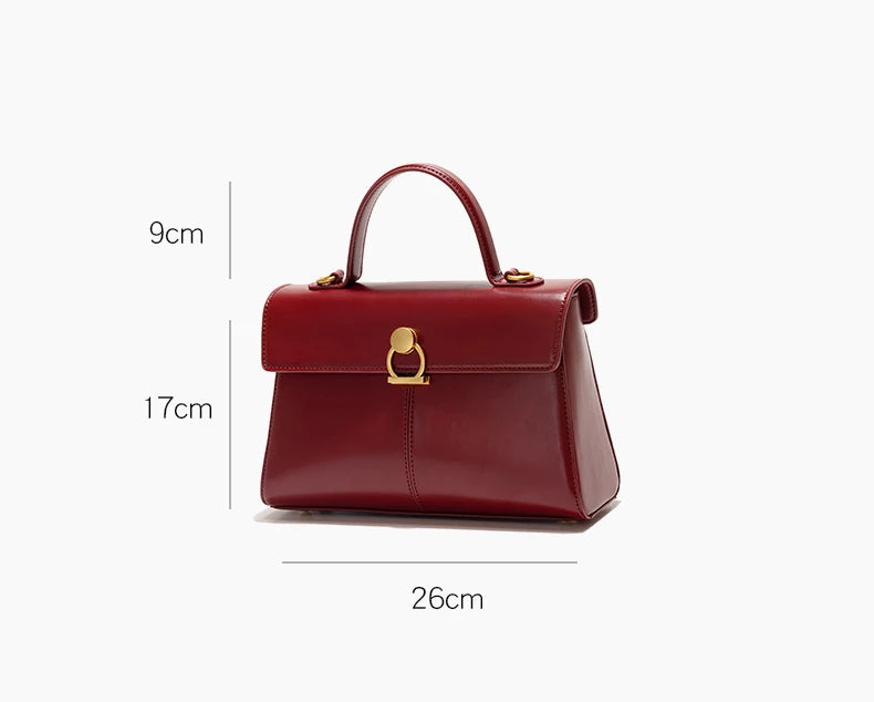Red handbag with measurement details on a white background