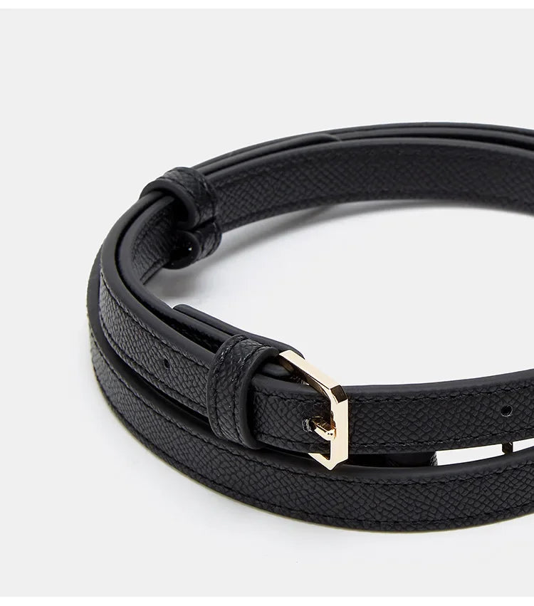 Black leather bracelet with a gold clasp on a white background