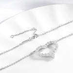 Silver heart-shaped pendant necklace on a white background