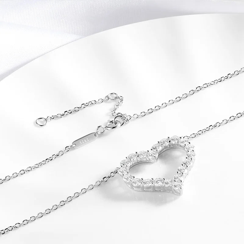 Silver heart-shaped pendant necklace on a white background