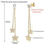 Gold earrings with floral designs and gemstones, shown with measurements.