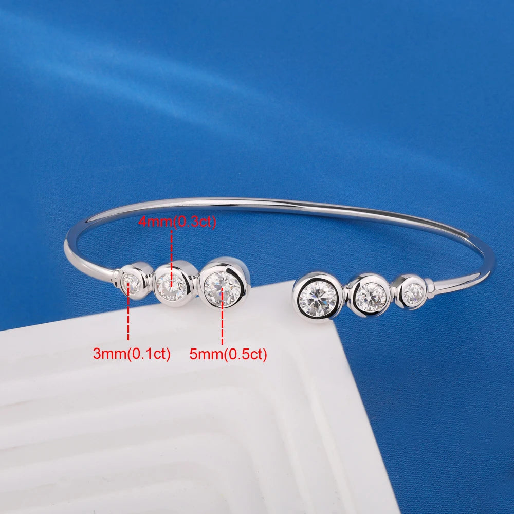 Silver bracelet with diamond beads on a blue background