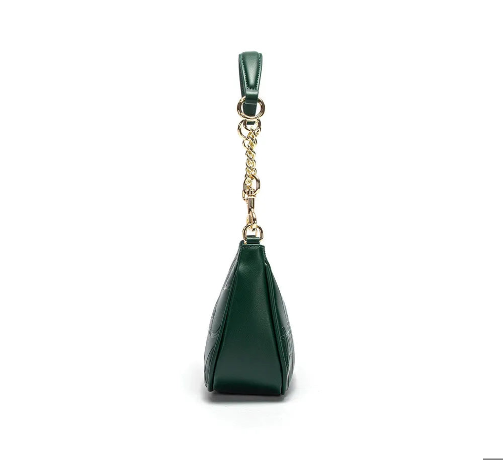 Green handbag with a gold chain on a white background