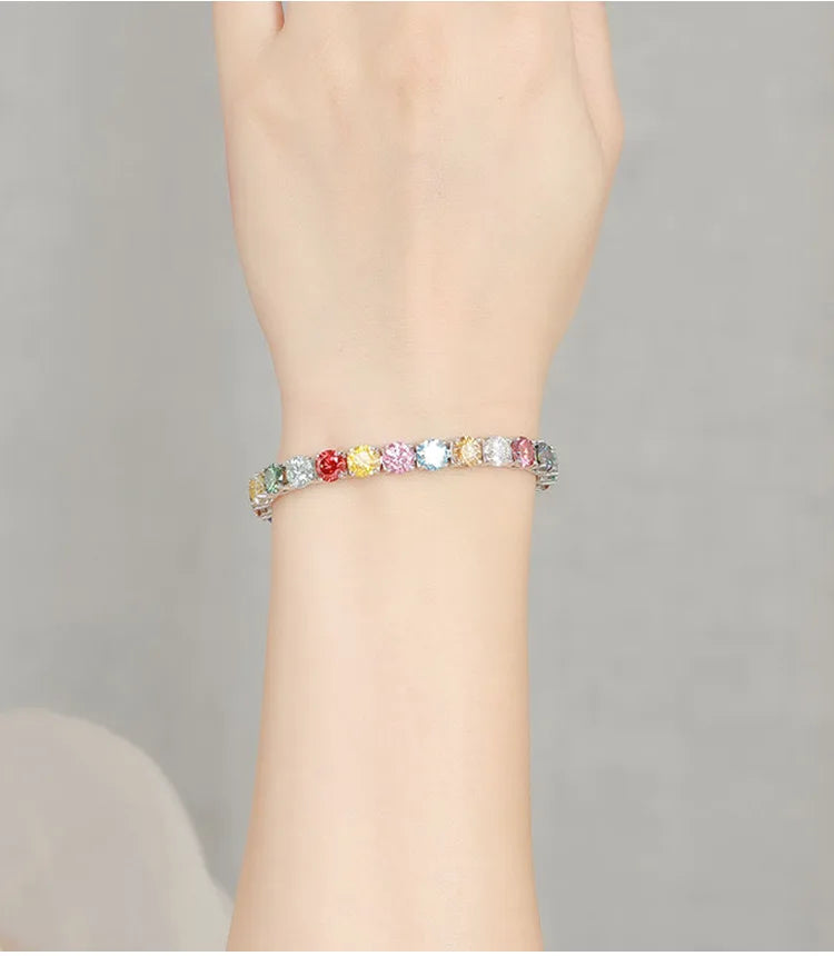 Multicolored beaded bracelet on a wrist against a neutral background