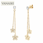 Gold butterfly earrings with clear stones on a white background, featuring the Vanaski brand.